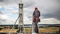 Network Rollout and System Integration Technician works on radio equipment during network rollout, implementation and system commissioning
